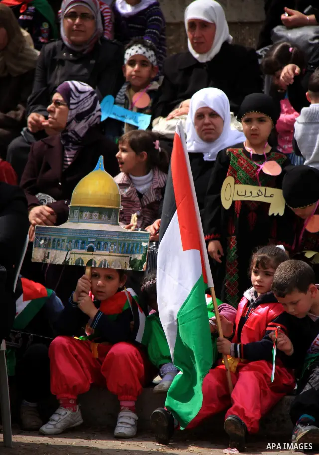 Palestinian children, some of them holding symbolic keys representing the keys to their homes snatched when the state of Israel was created, attend a rally to mark the day of "nakba" or the catastrophe on May 15, 2011 in...
