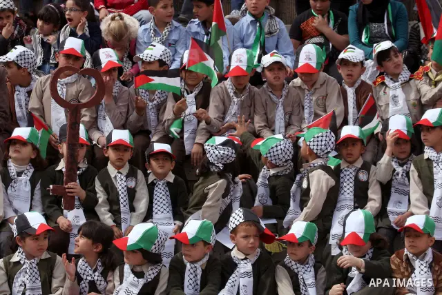 Palestinian children, some of them holding symbolic keys representing the keys to their homes snatched when the state of Israel was created, attend a rally to mark the day of "nakba" or the catastrophe on May 15, 2011 in...