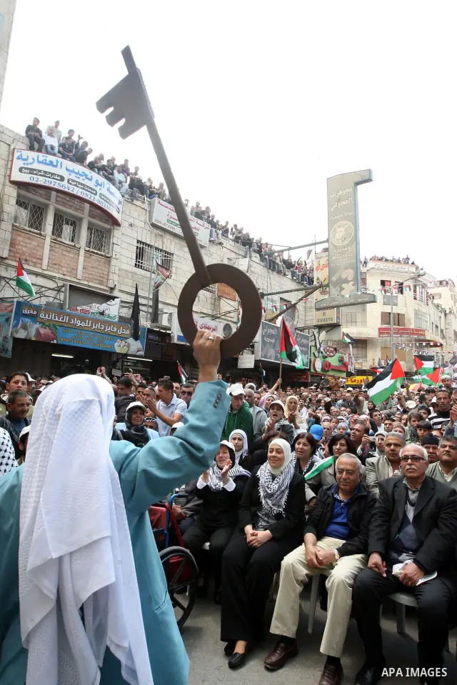 Palestinian Prime Minister, Salam Fayyad takes part in a rally marking the 63rd anniversary of 'Nakba', Arabic for 'Catastrophe', the term used to mark the events leading to Israel's founding in 1948 in the West Bank cit...