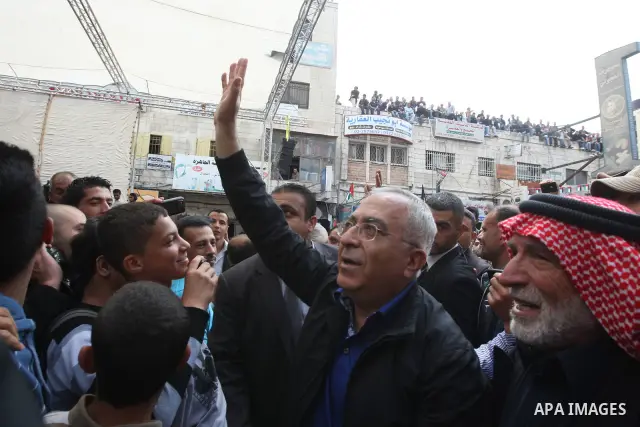 Palestinian Prime Minister, Salam Fayyad takes part in a rally marking the 63rd anniversary of 'Nakba', Arabic for 'Catastrophe', the term used to mark the events leading to Israel's founding in 1948 in the West Bank cit...