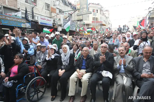 Palestinian Prime Minister, Salam Fayyad takes part in a rally marking the 63rd anniversary of 'Nakba', Arabic for 'Catastrophe', the term used to mark the events leading to Israel's founding in 1948 in the West Bank cit...