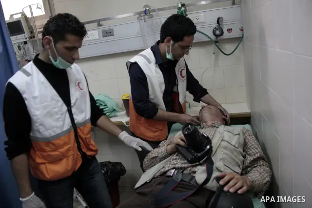 A Palestinian photographer Najeh Hashlamoun receive treatment at a hospital after he wounded when Israeli troops opened fire during confrontations in the restive West Bank city of Hebron as heavy clashes broke out near R...