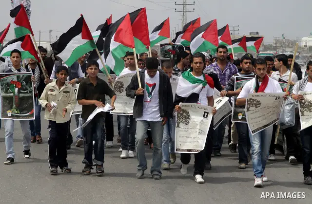 Palestinian protesters gather clsoe to the Erez crossing in the northern Gaza Strip, on May 15, 2011, as people gathered to mark the "nakbah" or "catastrophe" anniversary of Israel's creation in 1948, as a result of whic...