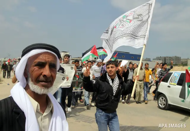 Palestinian protesters gather clsoe to the Erez crossing in the northern Gaza Strip, on May 15, 2011, as people gathered to mark the "nakbah" or "catastrophe" anniversary of Israel's creation in 1948, as a result of whic...