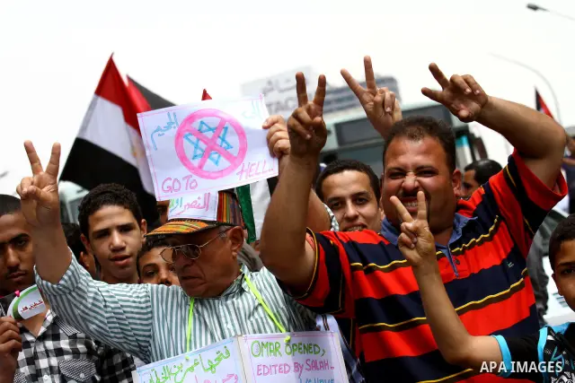 Egyptian protesters take part in a protest in front of the Israeli embassy in Cairo on May 15, 2011 in solidarity with Palestinians who mourned the "nakbah" anniversary of Israel's creation in 1948, as a result of which...