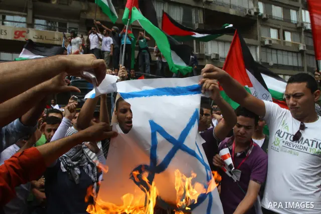 Egyptian protesters take part in a protest in front of the Israeli embassy in Cairo on May 15, 2011 in solidarity with Palestinians who mourned the "nakbah" anniversary of Israel's creation in 1948, as a result of which...