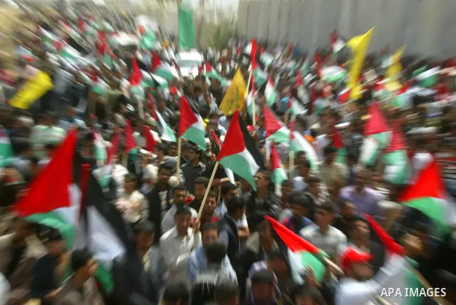 Palestinians rally along the Rafah border terminal between Egypt and the southern Gaza Strip, on May 15, 2011, during a gathering to mark the 63th anniversary of the "Nakba" (catastrophe). Nakba means "catastrophe" in re...