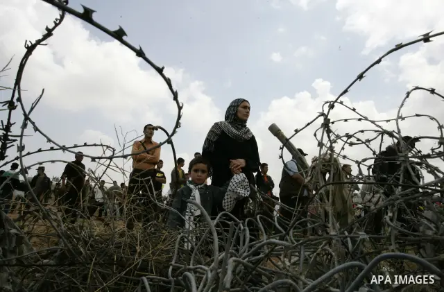 Palestinians rally along the Rafah border terminal between Egypt and the southern Gaza Strip, on May 15, 2011, during a gathering to mark the 63th anniversary of the "Nakba" (catastrophe). Nakba means "catastrophe" in re...