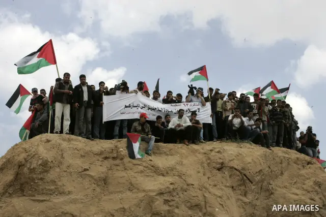 Palestinians rally along the Rafah border terminal between Egypt and the southern Gaza Strip, on May 15, 2011, during a gathering to mark the 63th anniversary of the "Nakba" (catastrophe). Nakba means "catastrophe" in re...