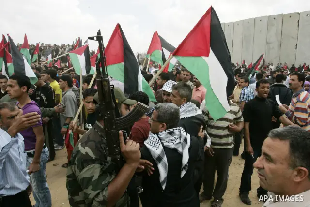 Palestinians rally along the Rafah border terminal between Egypt and the southern Gaza Strip, on May 15, 2011, during a gathering to mark the 63th anniversary of the "Nakba" (catastrophe). Nakba means "catastrophe" in re...