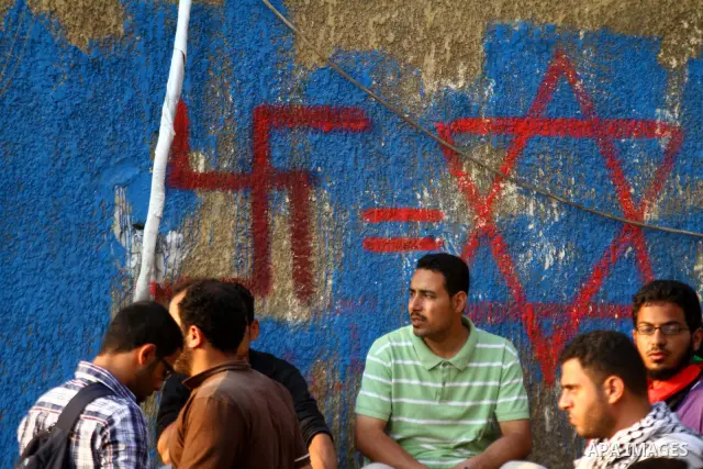 Egyptian protesters take part in a protest in front of the Israeli embassy in Cairo on May 15, 2011 in solidarity with Palestinians who mourned the "nakbah" anniversary of Israel's creation in 1948, as a result of which...