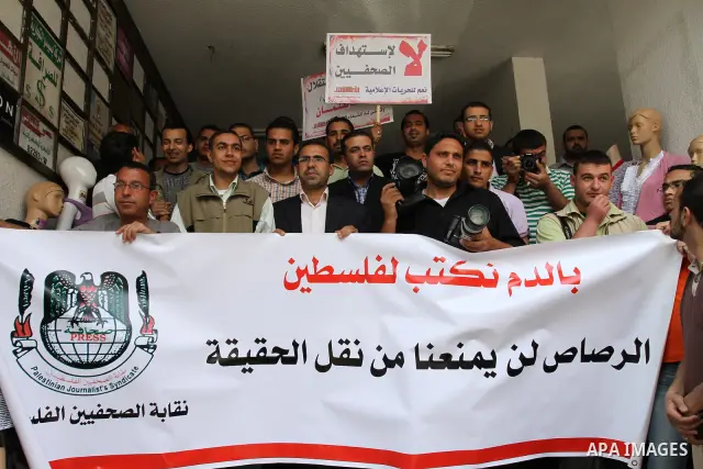 Palestinian journalists protest of the targeting of the freelance journalist Mohammed Othman yesterday from the israeli occupation in gaza city on May 16, 2011. Photo by Mohammed Asad