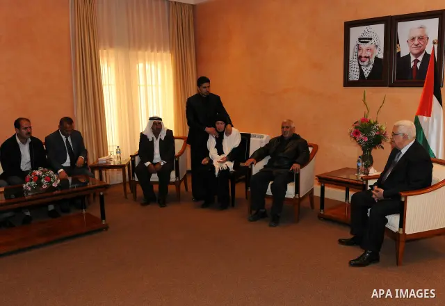Palestinian President Mahmoud Abbas (Abu Mazen) meets the family of the martyr Aya Baratha'a at his office in the biblical town of Bethlehem on May 16, 2011. Photo by Thaer Ganaim