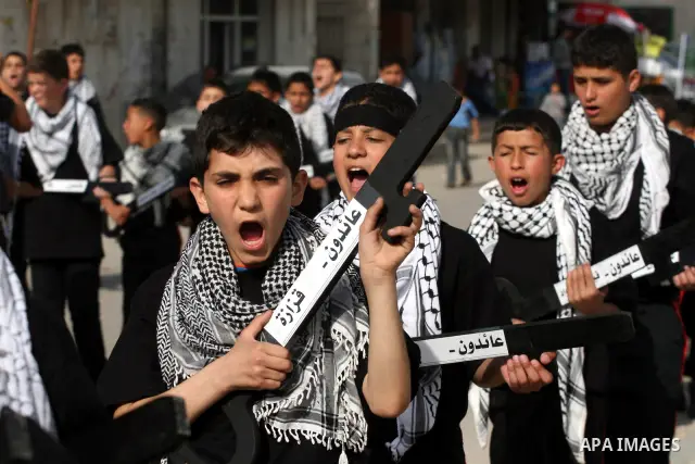 Palestinian boys hold symbolic keys as they take part in a rally marking "Nakba" in the West Bank city of Ramallah May 16, 2011. Palestinians mark the "Nakba", or "catastrophe", on Sunday to commemorate the expulsion or...