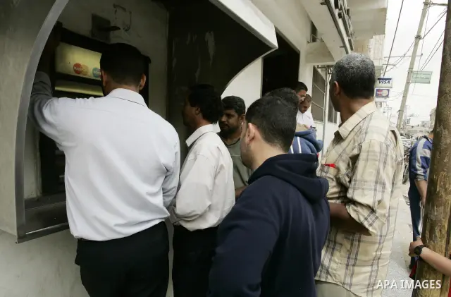 Palestinians employees received their salaries for the month of May through ATMs banks in Rafah in the southern Gaza Strip on May 17, 2011, Where Palestinian Authority delayed to pay salaries for this month after Israel...