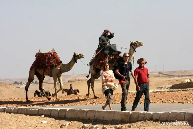 Foreign tourists visits the Giza Pyramids at the outskirts of Cairo, capital of Egypt. in this picture taken May 11, 2011. Photo by Ashraf Amra