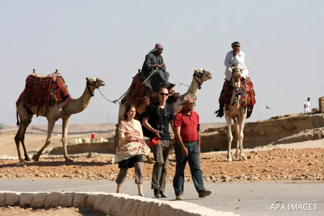 Foreign tourists visits the Giza Pyramids at the outskirts of Cairo, capital of Egypt. in this picture taken May 11, 2011. Photo by Ashraf Amra