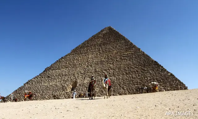 Foreign tourists ride Sentences near the Giza Pyramids at the outskirts of Cairo, capital of Egypt. in this picture taken May 11, 2011. Photo by Ashraf Amra
