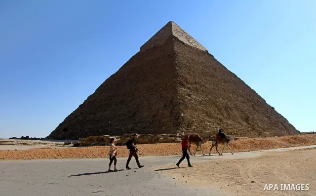 Foreign tourists visits the Giza Pyramids at the outskirts of Cairo, capital of Egypt. in this picture taken May 11, 2011. Photo by Ashraf Amra