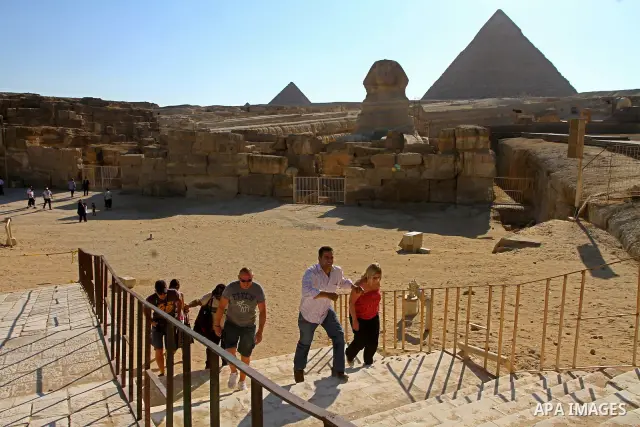 Foreign tourists visits the Giza Pyramids at the outskirts of Cairo, capital of Egypt. in this picture taken May 11, 2011. Photo by Ashraf Amra