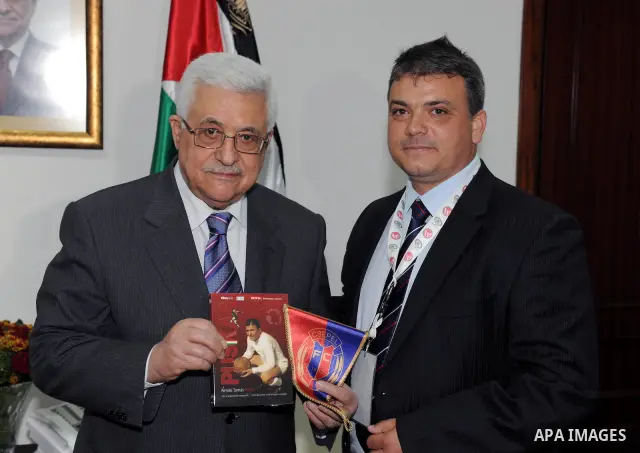 Palestinian President Mahmoud Abbas (Abu Mazen) during a meeting of the Hungary national football team in the West Bank city of Ramallah on May 18, 2011. Photo by Thaer Ganaim
