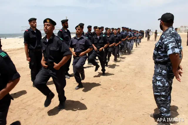Palestinian Hamas security forces march during a ceremony to honor the Palestinian policemen in Gaza city on May 19, 2011, in the occasion of recognition of the Palestinian Police College. Photo by Mohammed Asad