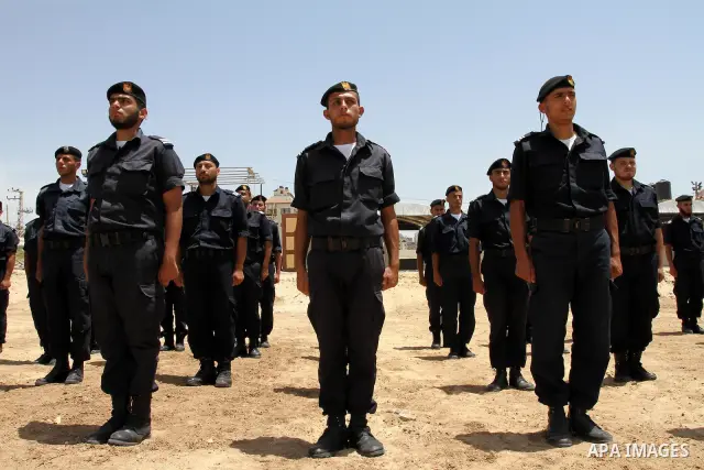 Palestinian Hamas security forces march during a ceremony to honor the Palestinian policemen in Gaza city on May 19, 2011, in the occasion of recognition of the Palestinian Police College. Photo by Mohammed Asad