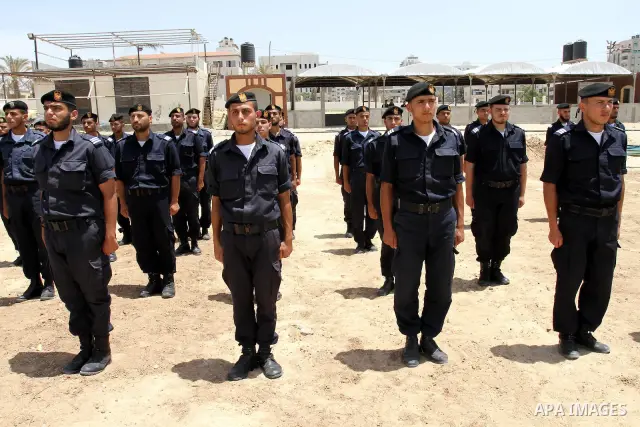 Palestinian Hamas security forces march during a ceremony to honor the Palestinian policemen in Gaza city on May 19, 2011, in the occasion of recognition of the Palestinian Police College. Photo by Mohammed Asad