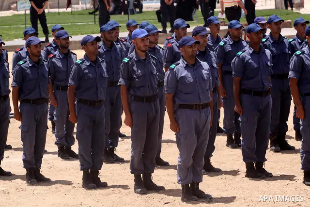Palestinian Hamas security forces march during a ceremony to honor the Palestinian policemen in Gaza city on May 19, 2011, in the occasion of recognition of the Palestinian Police College. Photo by Mohammed Asad