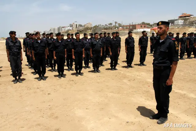 Palestinian Hamas security forces march during a ceremony to honor the Palestinian policemen in Gaza city on May 19, 2011, in the occasion of recognition of the Palestinian Police College. Photo by Mohammed Asad