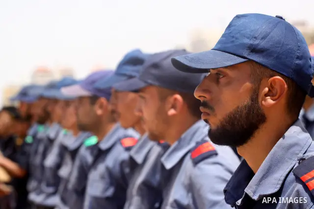 Palestinian Hamas security forces march during a ceremony to honor the Palestinian policemen in Gaza city on May 19, 2011, in the occasion of recognition of the Palestinian Police College. Photo by Mohammed Asad
