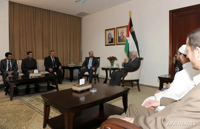 Palestinian President Mahmoud Abbas (Abu Mazen) during a meeting with the memorizers of the Holy Quran who won in advance centers in the international competitions in the West Bank city of Ramallah on May 19, 2011. Photo...