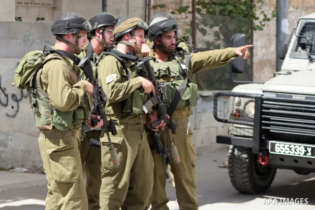 Israeli soldiers stand guard during clashes with Palestinian youths following a demonstration in the West Bank village of Al-khader near Bethlehem, Friday, May 20, 2011. President Barack Obama on Thursday finally uttered...