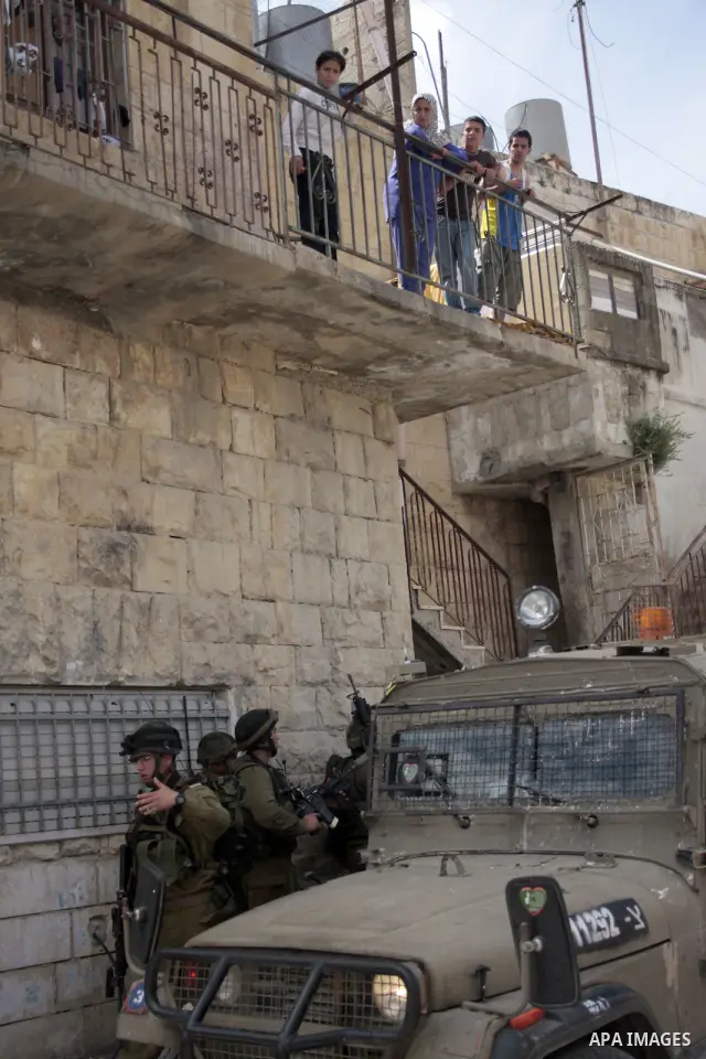 Israeli soldiers stand guard during clashes with Palestinian youths following a demonstration in the West Bank village of Al-khader near Bethlehem, Friday, May 20, 2011. President Barack Obama on Thursday finally uttered...