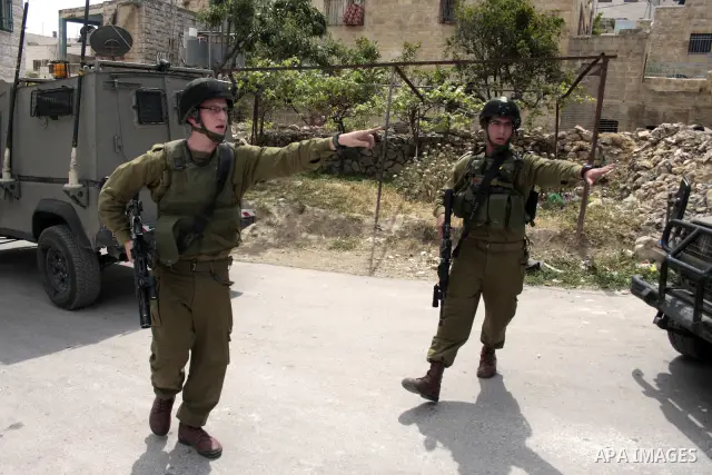 Israeli soldiers stand guard during clashes with Palestinian youths following a demonstration in the West Bank village of Al-khader near Bethlehem, Friday, May 20, 2011. President Barack Obama on Thursday finally uttered...