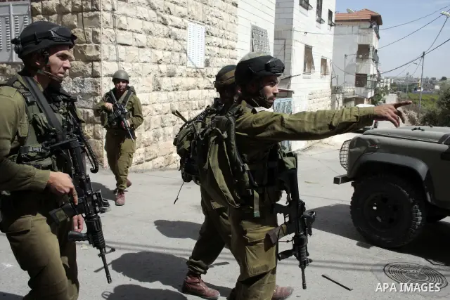 Israeli soldiers stand guard during clashes with Palestinian youths following a demonstration in the West Bank village of Al-khader near Bethlehem, Friday, May 20, 2011. President Barack Obama on Thursday finally uttered...