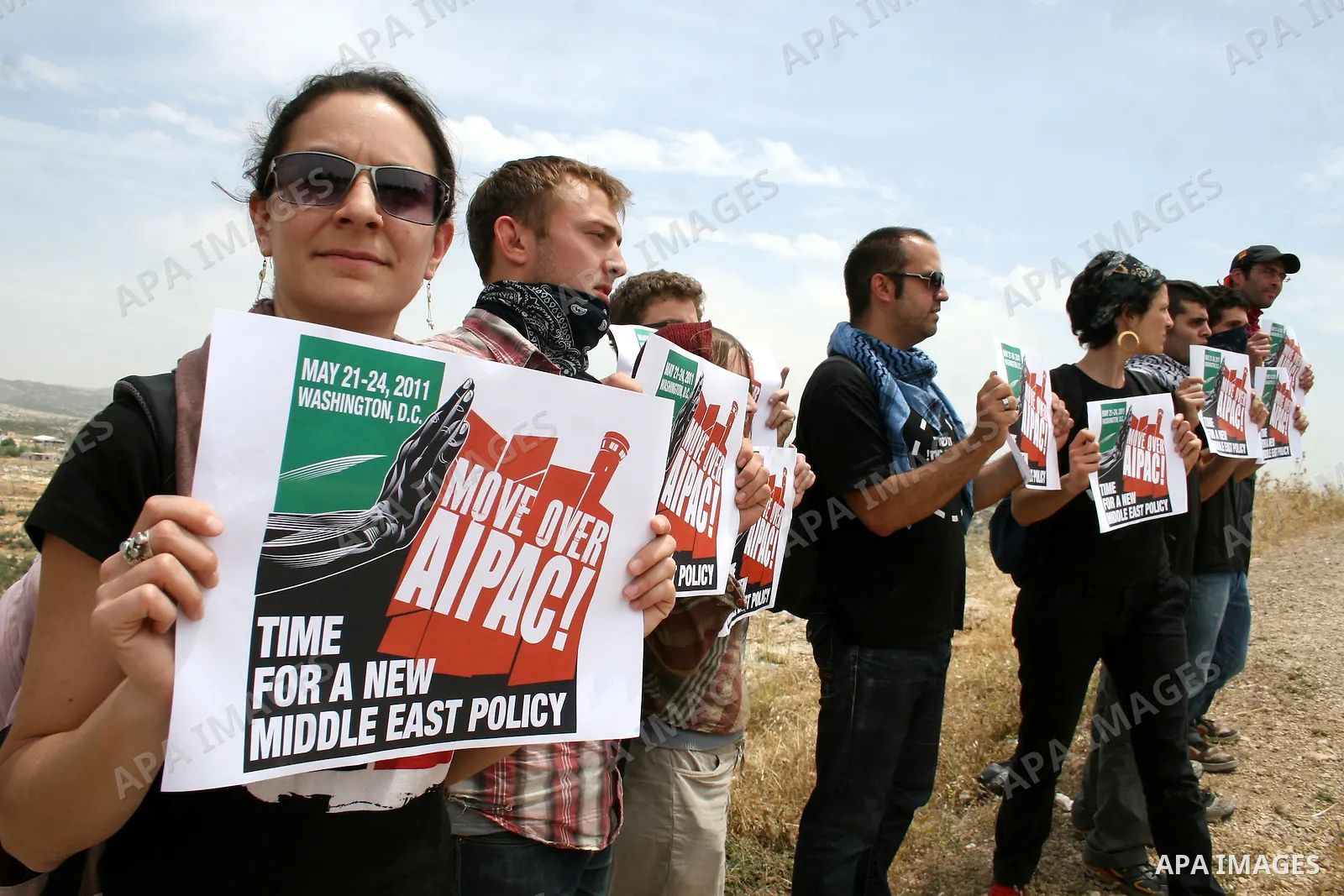 Foreign demonstrators hold banners during the weekly demonstration against Israel's separation barrier in the West Bank village of Bilin, near Ramallah, Friday, May 20, 2011. President Barack Obama on Thursday finally ut...