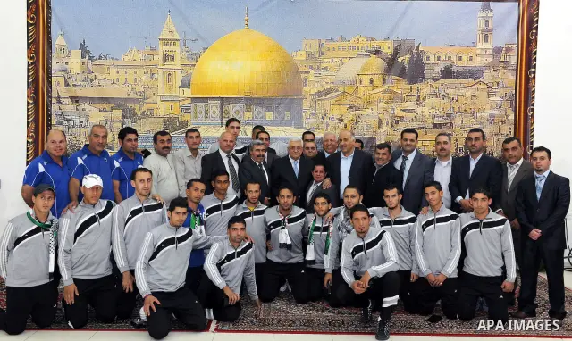 Palestinian President Mahmoud Abbas (Abu Mazen) during a meeting with sports media delegation and Albaqaa football team in the West Bank city of Ramallah on May 20, 2011. Photo by Thaer Ganaim