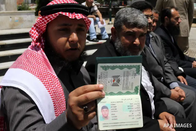 Palestinian man holds his passport during an effectiveness to prevent them from obtaining passports by Ramallah, in Gaza city on May 21, 2011. Palestinians condemn it , and calling for unity between Hamas and Fatah. Phot...