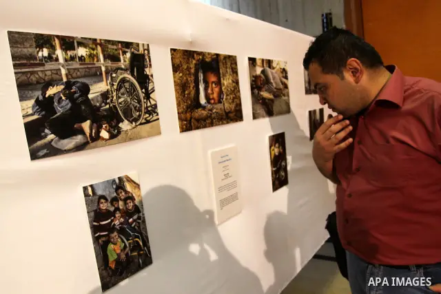 Palestinian winners of photography contest participate in the opening Photo Gallery contest, under the name " What you do not know about my life". which offered pictures of refugees in Gaza city on May 25, 2011. Photo by...