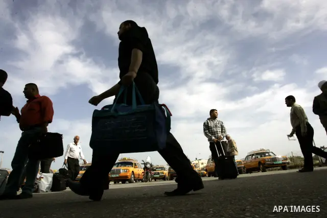 Palestinians wait to cross into Egypt through the Rafah border terminal in the southern Gaza Strip on May 26, 2011, a day after the official MENA news agency reported that Egypt will open the crossing on a daily basis st...