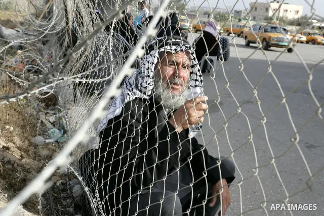 Palestinians wait to cross into Egypt through the Rafah border terminal in the southern Gaza Strip on May 26, 2011, a day after the official MENA news agency reported that Egypt will open the crossing on a daily basis st...