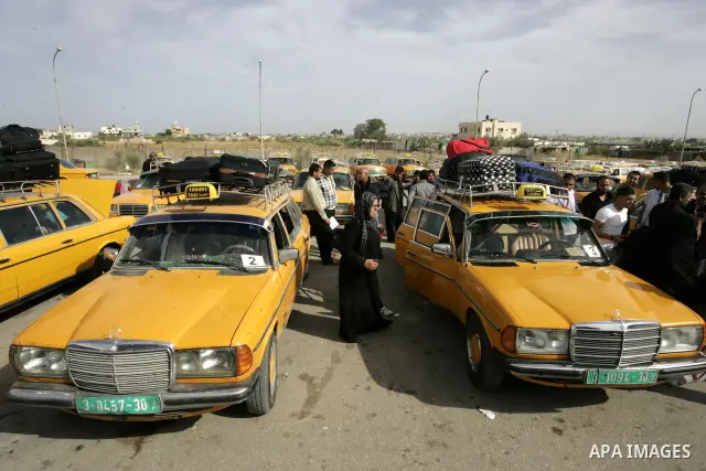 Palestinians wait to cross into Egypt through the Rafah border terminal in the southern Gaza Strip on May 26, 2011, a day after the official MENA news agency reported that Egypt will open the crossing on a daily basis st...