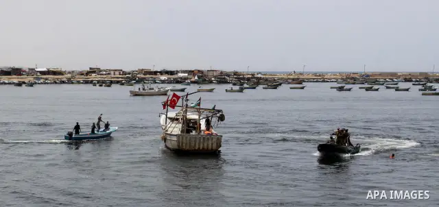 Hamas marine security take to the open waters during a drill in preparation for the arrival of ships expected to break the Israeli naval blockade on the port in Gaza City on the coast of the Mediterranean Sea on May 26,...