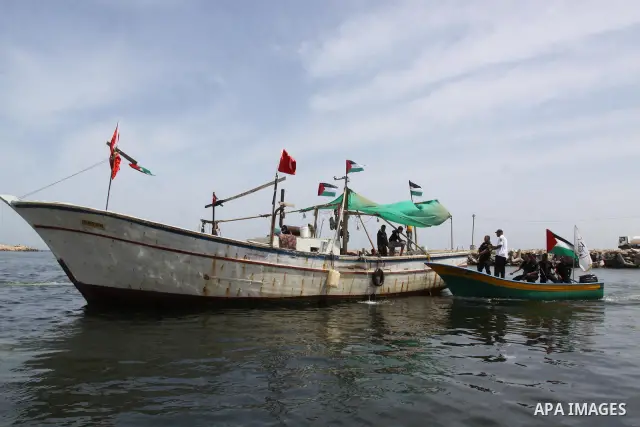 Hamas marine security take to the open waters during a drill in preparation for the arrival of ships expected to break the Israeli naval blockade on the port in Gaza City on the coast of the Mediterranean Sea on May 26,...
