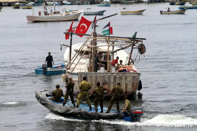 Hamas marine security take to the open waters during a drill in preparation for the arrival of ships expected to break the Israeli naval blockade on the port in Gaza City on the coast of the Mediterranean Sea on May 26,...
