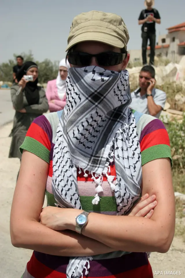 Palestinians and foreign peace activists take part in a demonstration against Israel's controversial separation barrier in the West Bank village of Maasarah, near Bethlehem, on May 27, 2011. Israel says the network of st...
