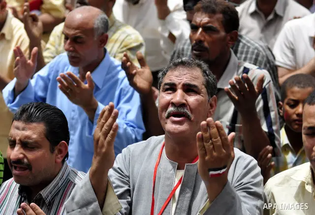 Egyptian protesters attend the weekly Muslim Friday prayers at Tahrir Square in Cairo, Egypt Friday, May 27, 2011. Thousands of protesters poured into downtown Cairo's Tahrir Square Friday for what they called a 'second...
