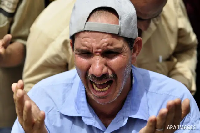 An Egyptian protester attends the weekly Muslim Friday prayers at Tahrir Square in Cairo, Egypt Friday, May 27, 2011. Thousands of protesters poured into downtown Cairo's Tahrir Square Friday for what they called a 'seco...