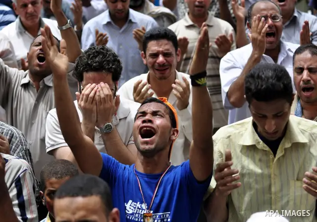 Egyptian protesters attend the weekly Muslim Friday prayers at Tahrir Square in Cairo, Egypt Friday, May 27, 2011. Thousands of protesters poured into downtown Cairo's Tahrir Square Friday for what they called a 'second...